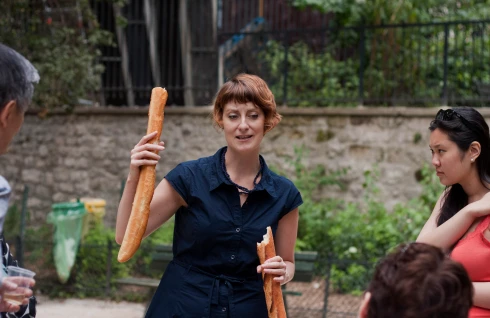 Meg Zimbeck comparing baguette quality on tour